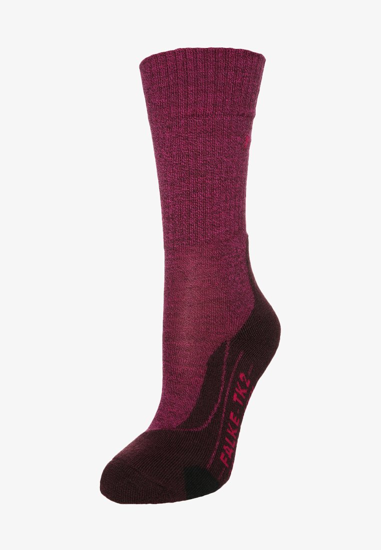 Calcetines de mujer en burdeos y púrpura con parte superior acanalada, cuerpo de punto texturizado y talón reforzado. Logo "Falke TK2" impreso en rosa en el lateral.