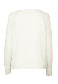 Weiße Bluse mit langen Ärmeln, die über eine durchsichtige Pünktchenstruktur, einen runden Ausschnitt und zarte Spitzenbesätze an den Bündchen verfügt.