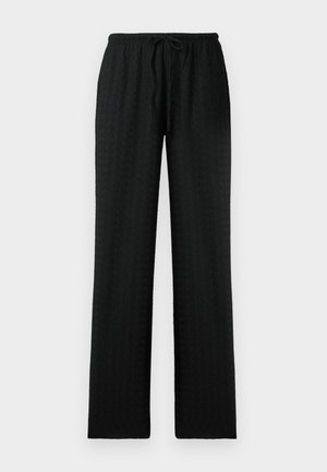 Zwarte broek met wijde pijpen van een textuurstof. Heeft een tailleband met trekkoord en een rechte snit. Eenvoudig ontwerp, geen zichtbare patronen of accenten.