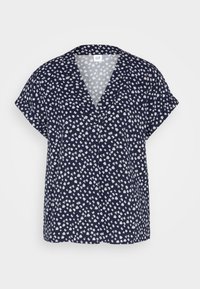 Blusa azul marino de manga corta, con escote en V y un estampado floral blanco. Tejido ligero con un corte suelto.
