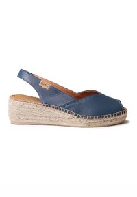 Blue leather slingback espadrille with a closed toe, jute rope wedge sole, and subtle stitching accents. Tags visible on the side.