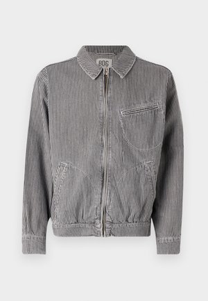 Striped zip-up jacket in gray and white, featuring a collar, two side pockets, and one chest pocket with horizontal zip detail.