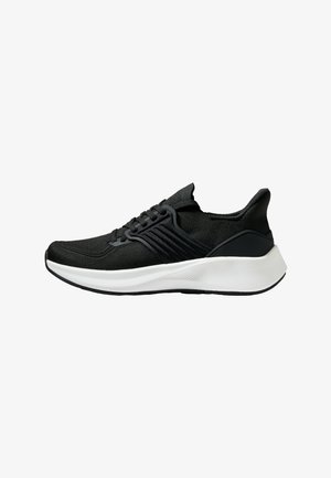 Black athletic shoe with a textured fabric upper, lacing system, and a white midsole. Features a low profile and curved sole design.