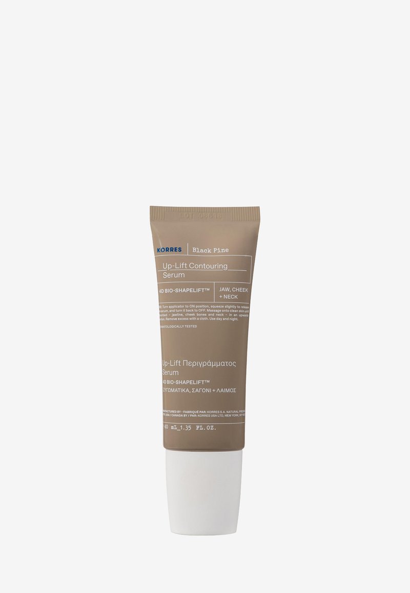 Bruine tube van Korres Black Pine Up-Lift Contouring Serum met een witte basis. Het etiket bevat de productnaam en gebruiksinstructies in meerdere talen.