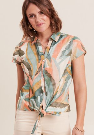 Short-sleeve button-up shirt in lightweight fabric featuring a multicolored leaf pattern, with a knotted front detail and collar.