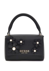 Sac à main en cuir noir avec des accents floraux et des détails en perles. Il dispose d'une poignée supérieure et d'un logo doré indiquant "GUESS EST 1981". Design compact.