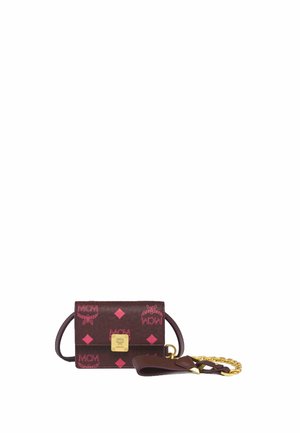 Small brown wallet with pink MCM logo patterns, a gold square emblem on front, and a detachable brown and gold chain strap.