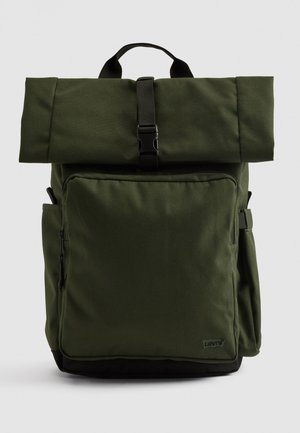 Green polyester backpack with roll-top design, adjustable buckle, front zip pocket, and side pocket; features black accents at the base.