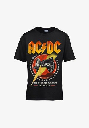 T-shirt in cotone nero con grafica AC/DC, fulmine giallo, sfondo rosso circolare e illustrazione di un cannone. Testo: "PER CHI STA PER ROCKARE."