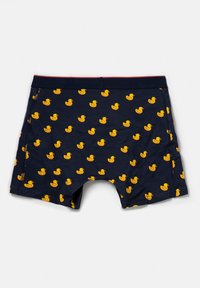 Marina boxershorts med ett mönster av små gula gummiankor. Mjuk tyg med elastisk midja, accentuerad i röd.