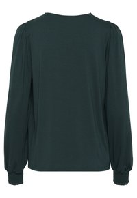 Haut à manches longues vert foncé avec un col rond, présentant des détails de manches froncées et des poignets élastiques. Tissu doux et texture lisse.
