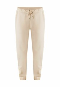 Beige joggerbroeken van zacht materiaal, met een elastische tailleband, trekkoord en drukknopen aan de enkels.