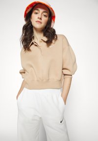 Nike Sportswear W NSW STYLE FLC CROP 3Q POLO - Camisola - beige