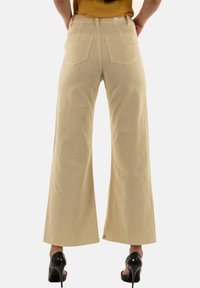 PLEASE Pantaloni - beige