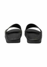 Black slip-on sandals with two wide straps, textured footbed, and a flat sole. Minimalist design with a smooth finish and no added accents.