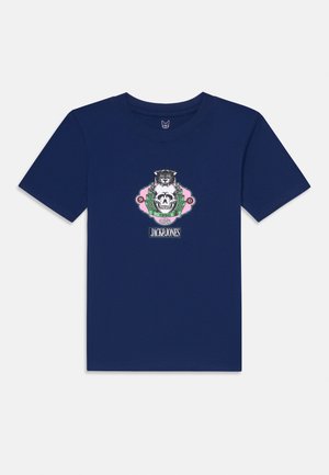 Tamna plava pamučna majica s grafičkim dizajnom koji prikazuje lubanju, tigra i lovorove listove. Okrugli izrez i kratki rukavi.