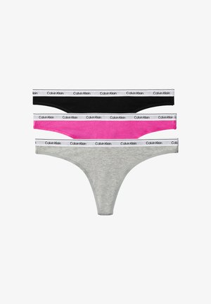 Drei Damen-Strings in Schwarz, Pink und Grau mit weißen Gummibändern, die mit "Calvin Klein" gebrandet sind.