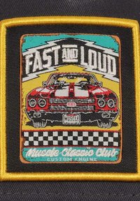 Red and white embroidered patch featuring a classic car, with "FAST and LOUD" text, checkered border, and colorful background. Yellow trim.