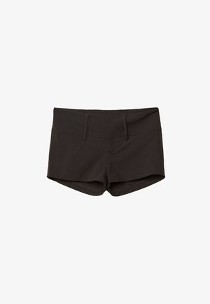 Svarta bomullsshorts med en figurnära design, som har en mjuk yta och två framfickor. Midje med medelhög höjd och inga synliga mönster.