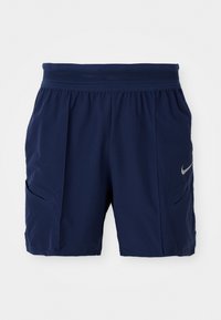 Navy blue athletic shorts made from lightweight fabric, featuring a stretchy waistband, two side pockets, and a small silver Nike logo.