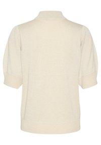 Pull court à manches courtes beige clair avec un col montant, des poignets et un ourlet côtelés. Texture douce avec un effet scintillant subtil sur l'ensemble.