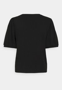 T-shirt noir à côtes avec des manches courtes bouffantes, un col rond et une texture douce. Design simple sans motifs ni embellissements.