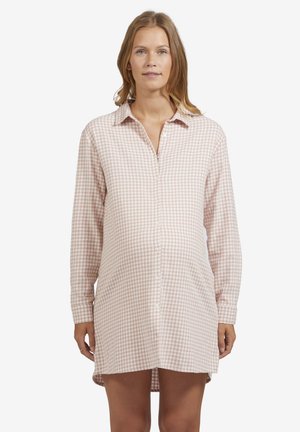 Pink and white checkered shirt dress with a button front, long sleeves, and a relaxed fit, made of soft fabric, reaching mid-thigh.
