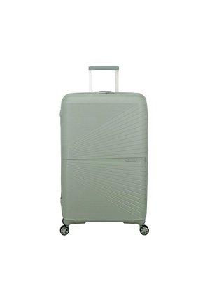 Valigia rigida verde chiaro con motivo geometrico testurizzato, quattro ruote girevoli e manico telescopico estendibile.