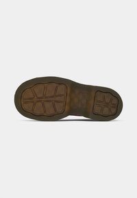 Rubber sole with a textured pattern, featuring a brown and black color scheme. The design includes deep grooves for traction.