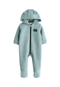 Lyseblå hættetrøje-dragt i tekstureret stof med en lynlås foran, bjørneører på hætten og et logopatch på brystet.