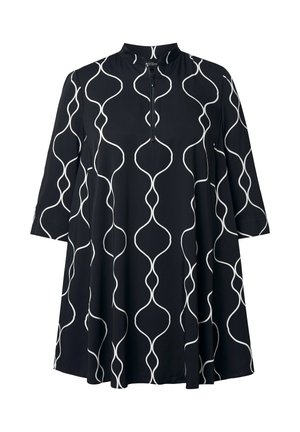 Túnica negra en línea A con mangas 3/4, líneas verticales blancas onduladas, cuello alto y cierre frontal con cremallera hasta la mitad.