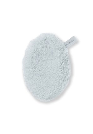 Round light blue microfiber facial cleansing pad with fabric loop tag on white background.