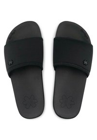 Black slide sandals featuring a soft, flexible strap and textured sole. Accented with a small, embossed flower logo on the strap.