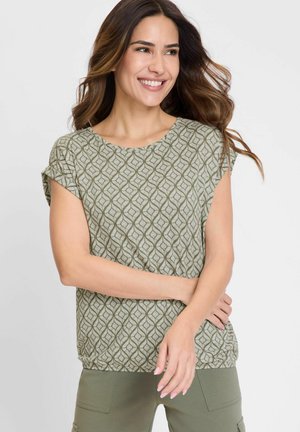 Olive-green patterned top with a rounded neckline and short sleeves. Features a wavy geometric design and soft fabric texture.