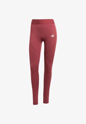 Bordové športové legíny vyrobené z hladkej látky, s vysokým pásom a tromi bielymi pruhmi loga na ľavom stehne.