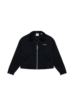 Giacca nera tagliata realizzata in tessuto liscio. Presenta una chiusura con zip, due tasche frontali e il logo 'GUESS' in oro sul lato sinistro.