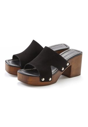 Black suede platform sandals with an open toe, wooden block heel, and silver stud accents. Features a wide strap across the top.