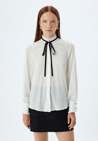Koton RUFFLE HIGH NECK - Button-down blouse - off white