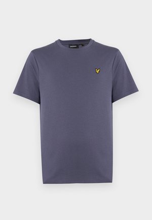 Camiseta de hombre de manga corta en algodón morado oscuro, con cuello redondo y un pequeño emblema de un pájaro amarillo en el pecho izquierdo.
