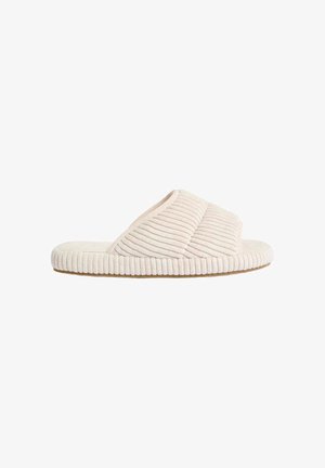 Helle beige Hausschuhe mit einem gerippten Stoffobermaterial, überkreuztem Design und strukturiertem Fußbett. Das weiche Material sorgt für Komfort beim Tragen in Innenräumen.