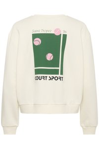 Felpa color crema con stampa grafica di un campo da tennis, sfondo verde, palline da tennis rosa e testo "Saint Tropez '86 COURT SPORT".