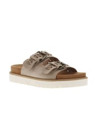 Light beige slide sandals with two decorative straps, featuring metal buckles. Textured insole and a white, slightly elevated sole.