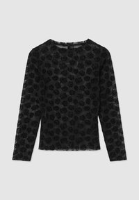 Haut noir à manches longues avec une texture transparente, présentant un motif floral de roses. Encolure ronde et coupe droite. Pas de fermetures visibles.
