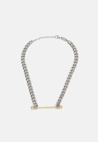 Chain necklace featuring silver-colored links with a gold bar accent in the center, showcasing contrasting materials and finishes.