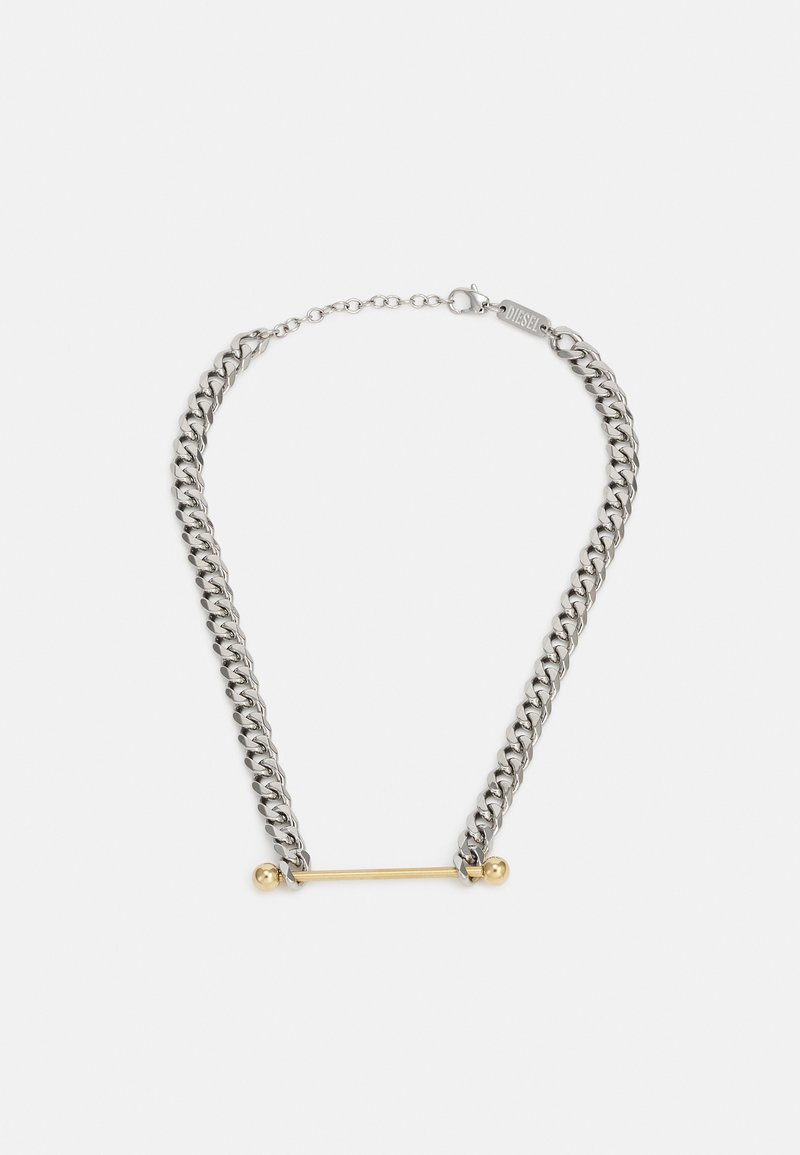 Chain necklace featuring silver-colored links with a gold bar accent in the center, showcasing contrasting materials and finishes.