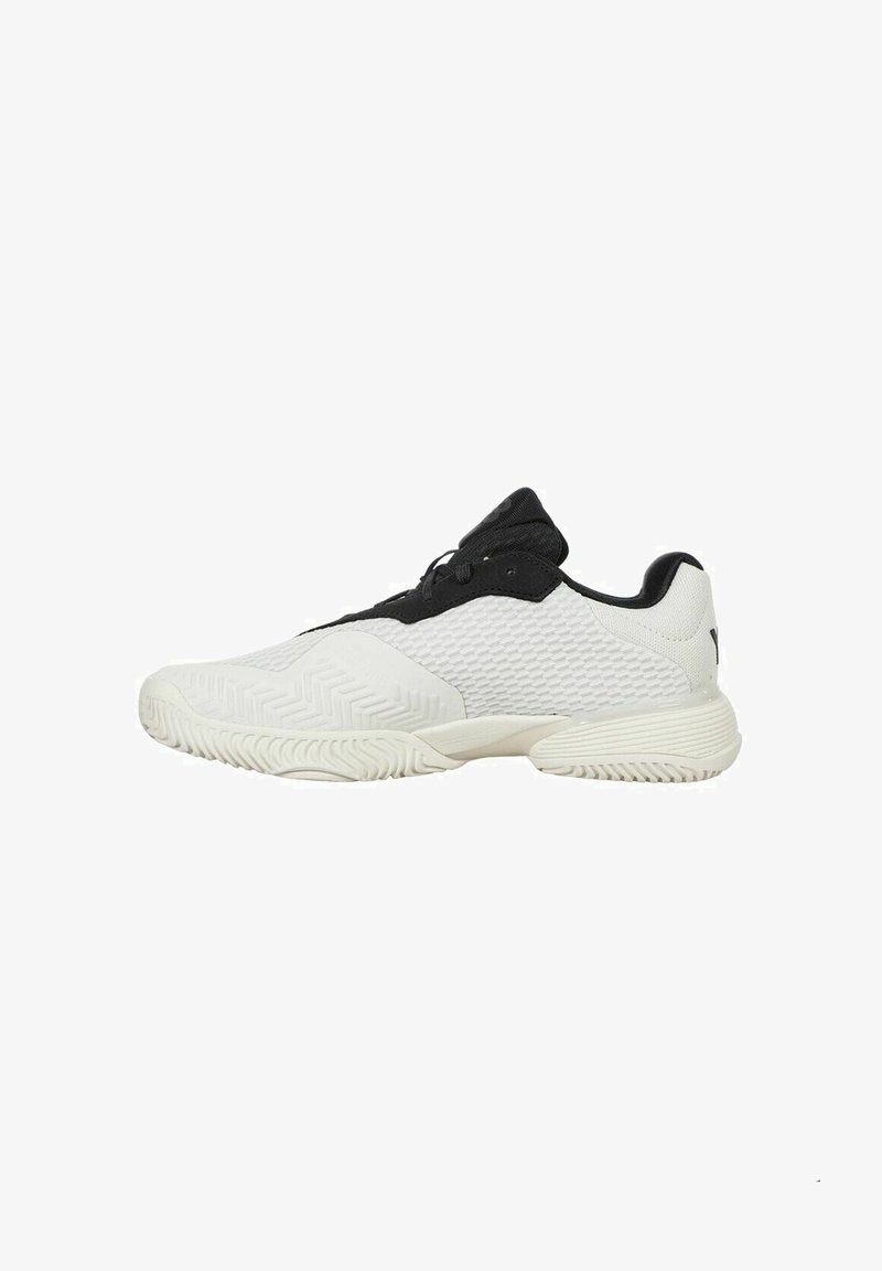 White and black athletic shoe with a textured mesh upper, rubber sole, rounded toe, and contrasting accents on the laces and heel.
