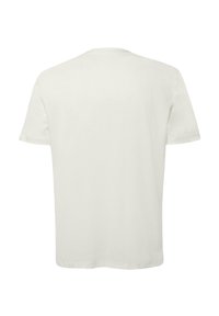 Short-sleeve t-shirt in cream cotton, featuring a crew neck, relaxed fit, and smooth texture. No graphics or patterns.