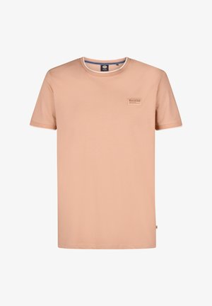 Peach-colored cotton t-shirt with a crew neckline, short sleeves, and a small branded patch on the chest. Features contrasting white trim.
