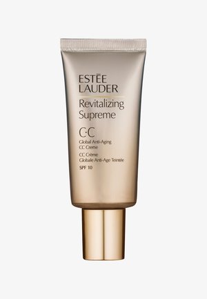 Crema C.C. Revitalizing Supreme de Estée Lauder en un tubo metálico dorado. Presenta una forma redondeada, un tapón de rosca y texto en relieve. SPF 10.