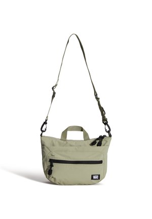 Borsa a tracolla Vans verde chiaro con tasca frontale con cerniera, cursori neri e tracolla regolabile su sfondo bianco.